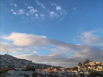 Houses in a city against sky