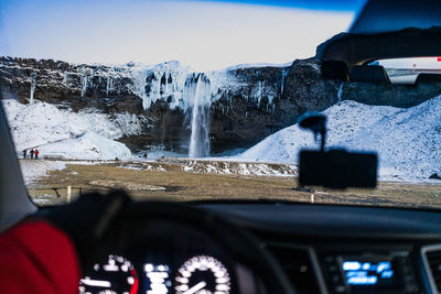 View of snow through car windshield