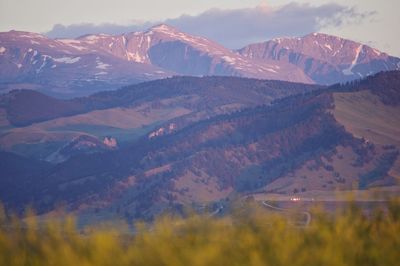 Scenic view of snowcapped mountains against sky