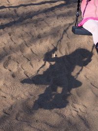 High angle view of shadow on sand at beach