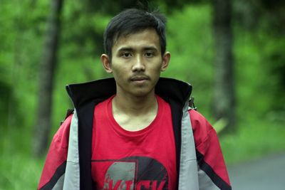 Portrait of young man standing outdoors