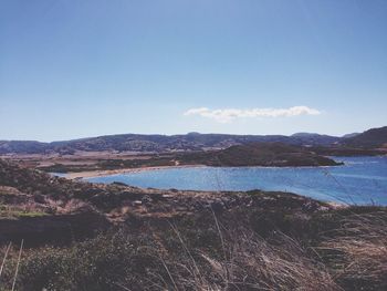 Scenic view of sea against blue sky