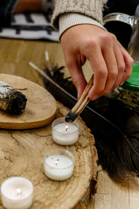 Cropped hand of person preparing tea ceremony 