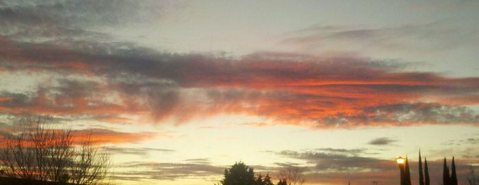 Scenic view of cloudy sky at sunset