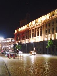 Buildings in city at night