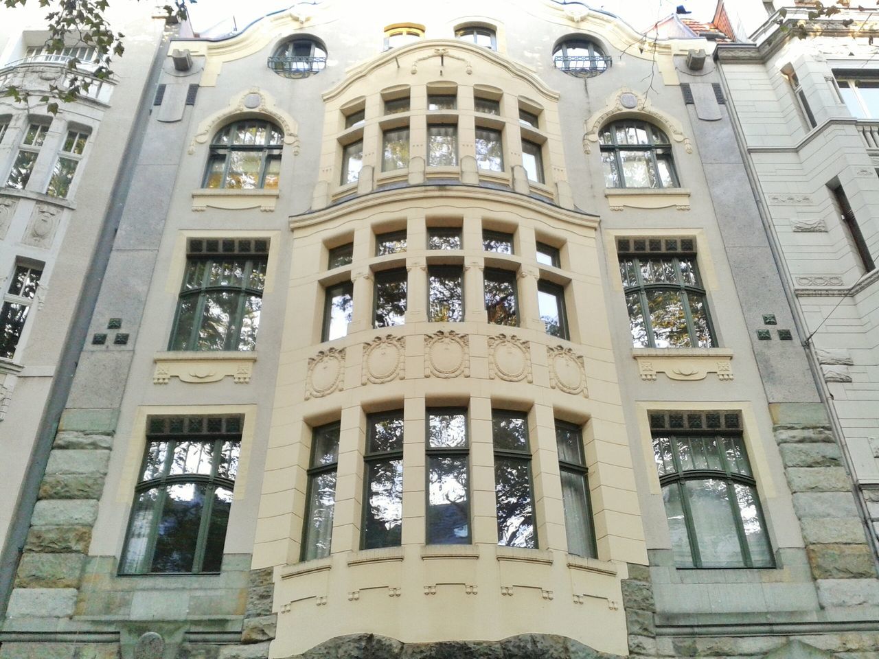 architecture, built structure, building exterior, window, low angle view, arch, facade, building, city, history, day, old, architectural feature, outdoors, no people, architectural column, historic, travel destinations, entrance, ornate