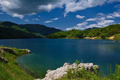 Scenic view of lake against blue sky