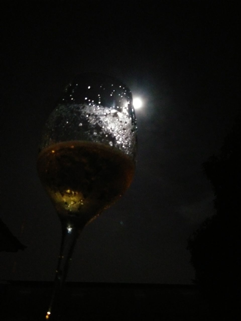 no people, glass, drink, close-up, refreshment, food and drink, freshness, still life, alcohol, nature, indoors, water, illuminated, night, low angle view, champagne, wine, reflection, sky, nightlife