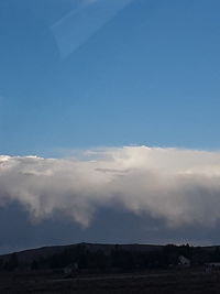 Low angle view of land against sky