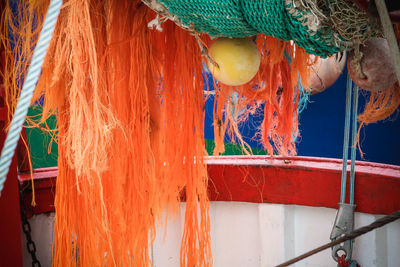 Close-up of fishing net hanging on rope