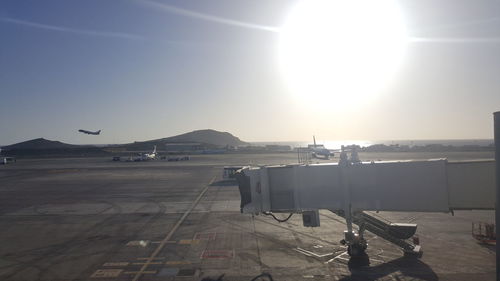 Airplanes on airport against clear sky