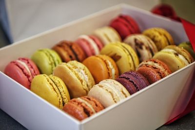 Close-up of multi colored macaroons in box