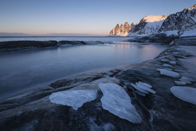 Scenic view of sea against sky during winter