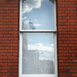 Brick wall with buildings in background