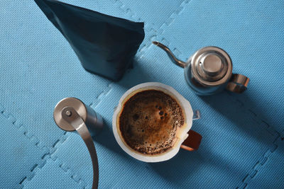 Directly above shot of coffee cup against white background