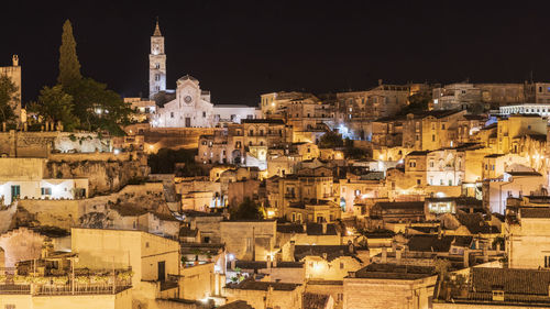 High angle view of buildings in city at night