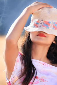 Young woman wearing hat