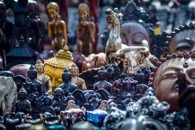 Various statues for sale at market stall