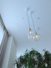 Low angle view of glass hanging from ceiling