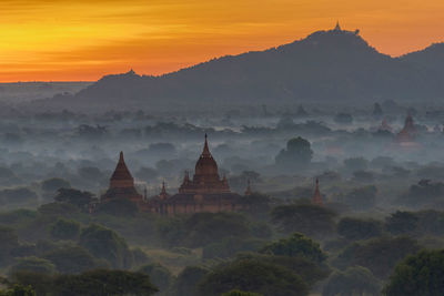 Temple against sky during sunset