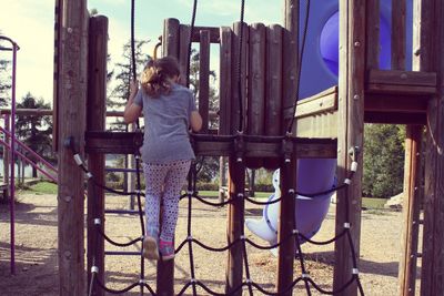Full length of man standing by railing
