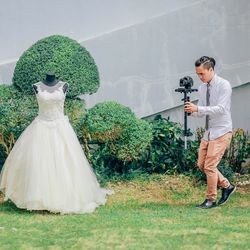 People standing by plants against trees