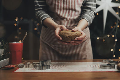 Merry christmas, happy new year. gingerbread cooking, cake, biscuit, strudel baking. woman in apron