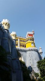 Low angle view of building against blue sky