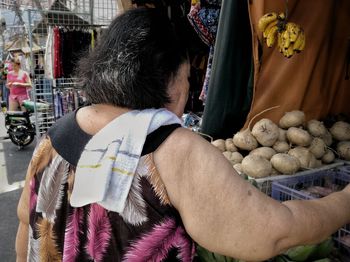 Rear view of man and woman in market