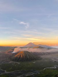 View of volcanic landscape against sky during sunset