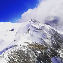 Snow covered mountains against sky