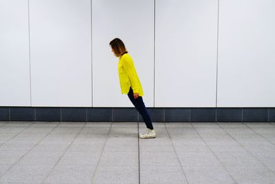 Full length of woman standing on ground