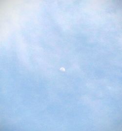 Close-up of moon against blue sky