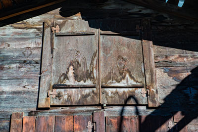 Low angle view of old wooden door