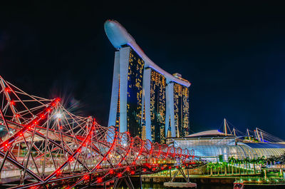 Low angle view of illuminated ferris wheel at night