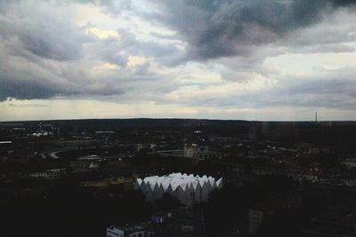 High angle view of buildings against cloudy sky