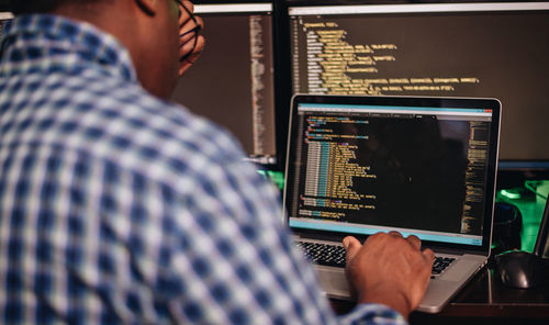 Close-up of computer programmer working at office