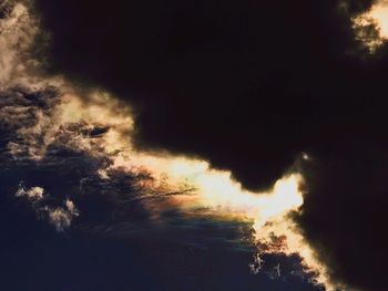 Silhouette trees against sky at night