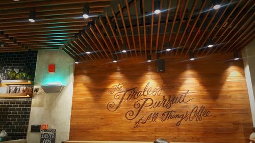 Text on illuminated wall
