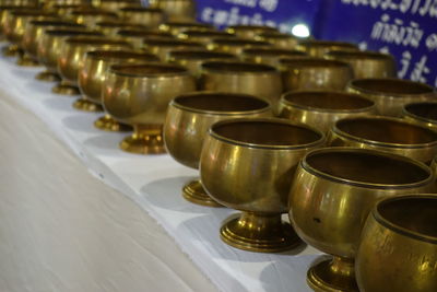 Close-up of tea light candles in temple