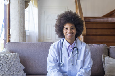 Portrait of doctor sitting at home