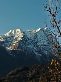 Scenic view of snowcapped mountains against clear sky