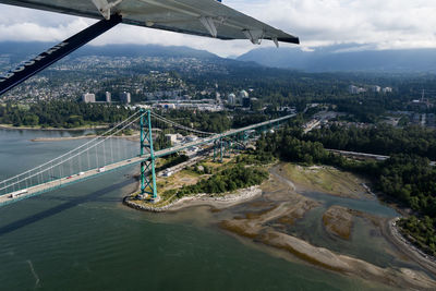 Aerial view of bridge over river in city