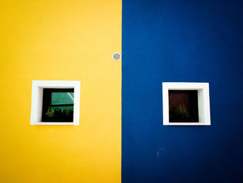 Close-up of yellow door of building