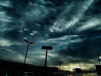 Low angle view of road against cloudy sky