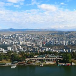 Aerial view of city buildings against sky