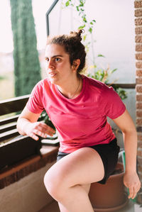 Portrait of woman sitting outdoors