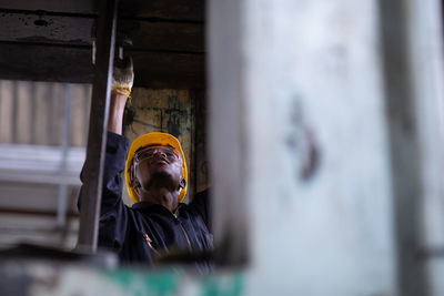 Low angle view of worker in factory