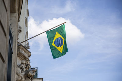 Low angle view of flag against building