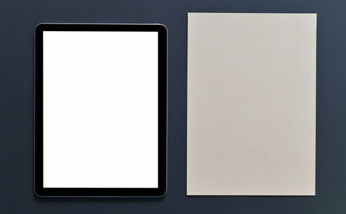Close-up of empty coffee cup against white background